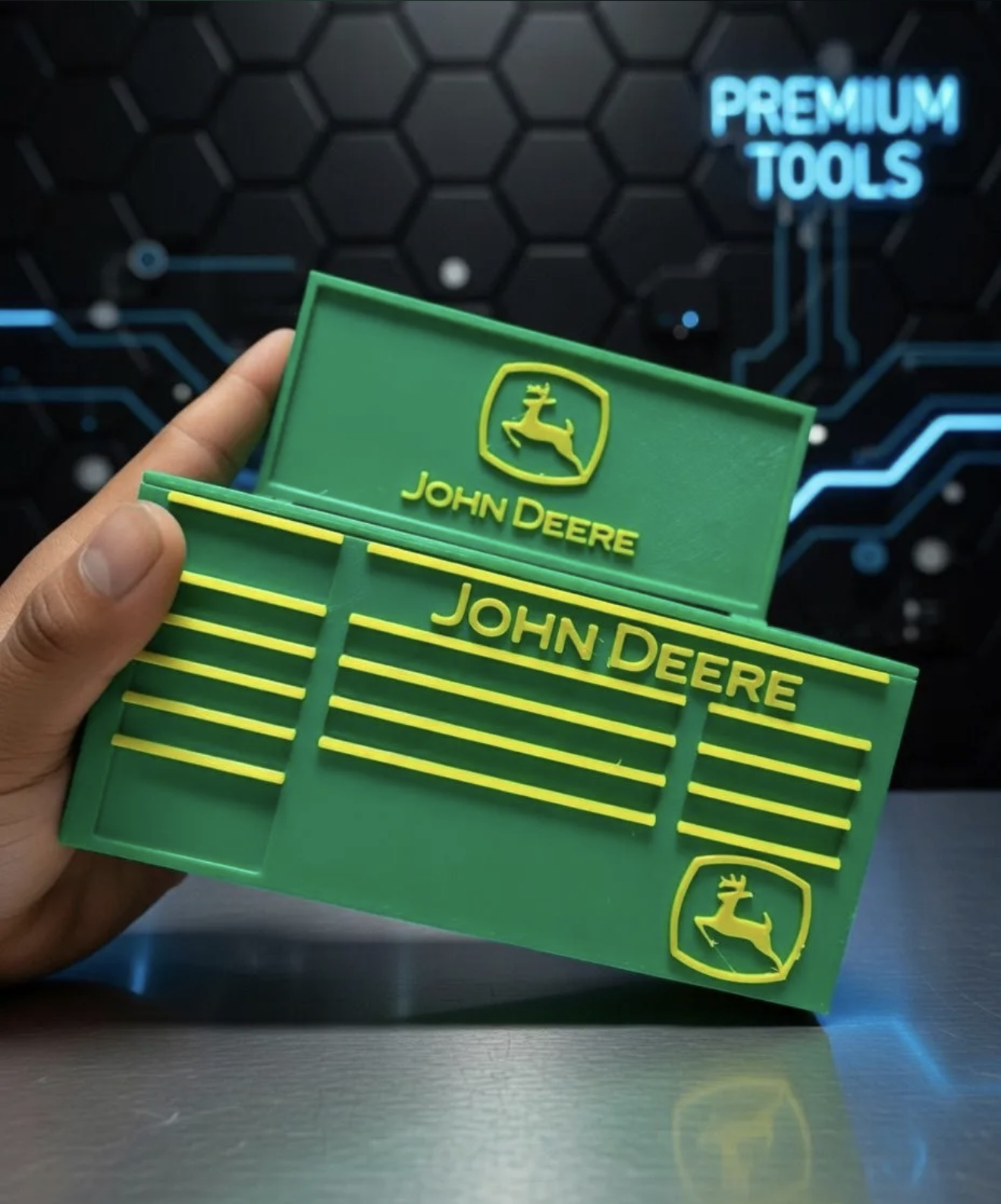 Custom 3D printed green and yellow mini tool box with logo-style details.