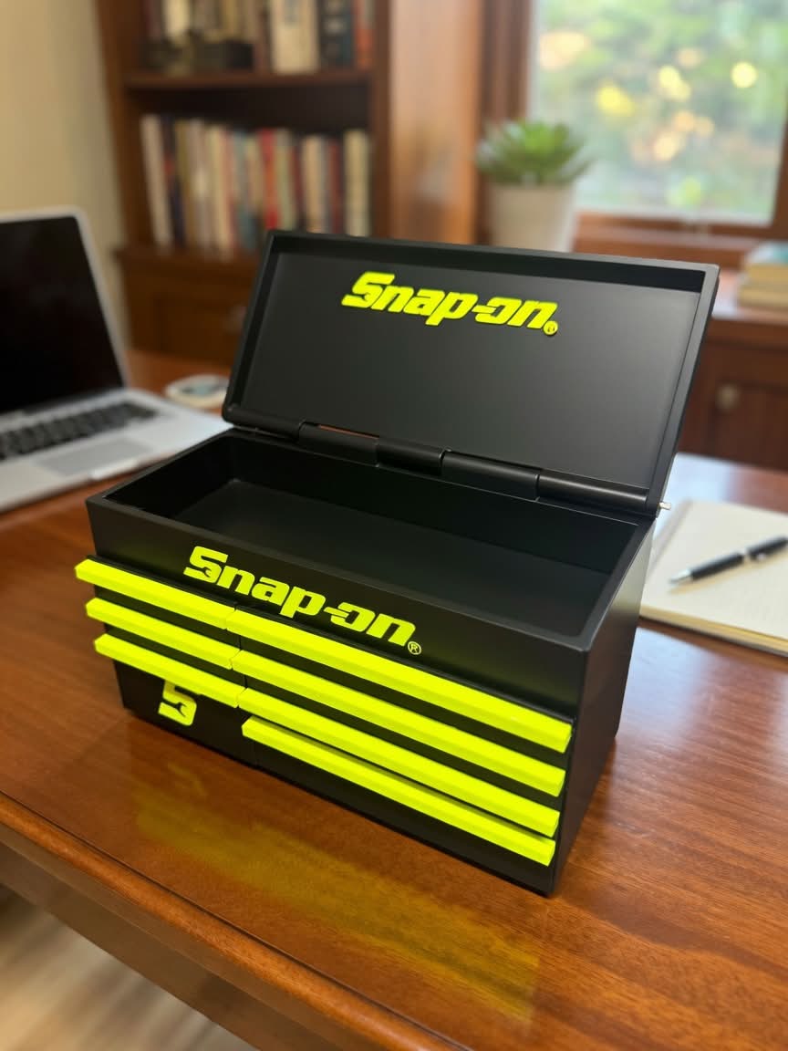 Large black and lime 3D printed garage-style tool box with an open lid and drawer-detail front.